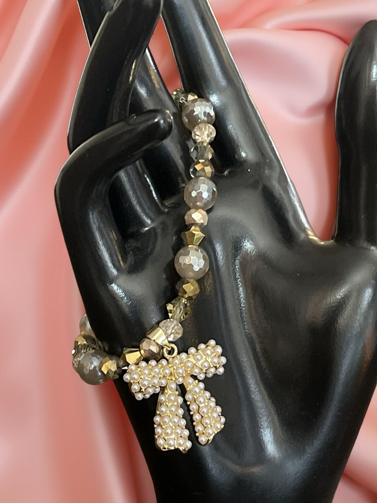 BOW BEAUTIFUL PEARL BOW WITH GOLD, GRAY, TAUPE AND SILVER BEADS BRACELET