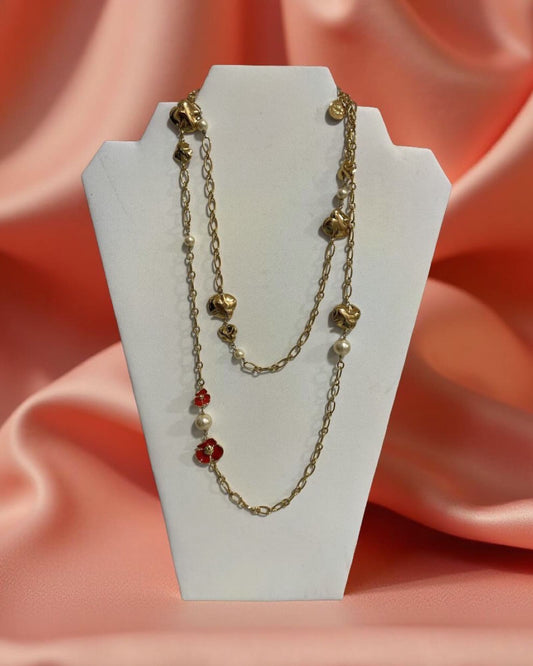 TORY BURCH FLEUR ROSARY RED GOLD AND YELLOW GOLD PLATED NECKLACE.